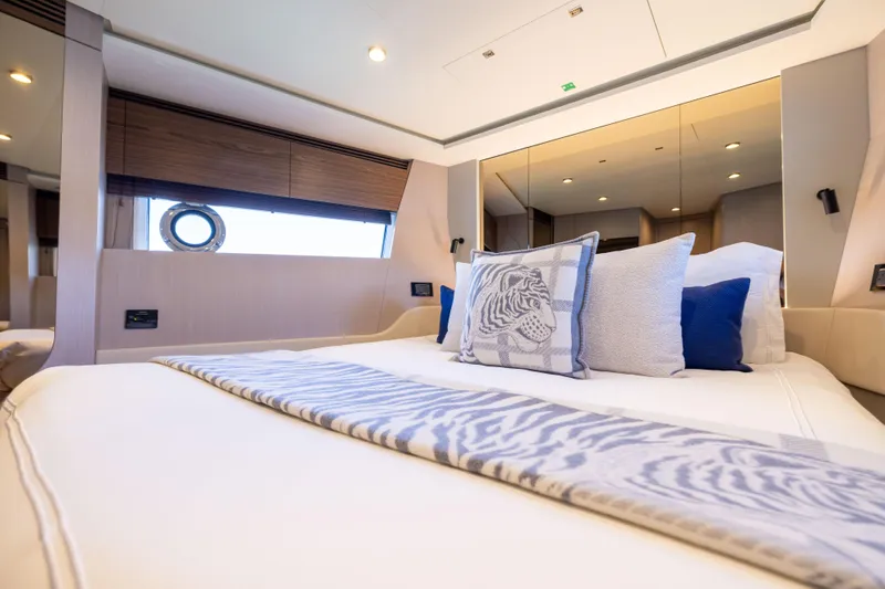 Second Chances Yacht Photos Pics Luxurious bedroom interior of 2024 Azimut S7 yacht with elegant bedding and decor.