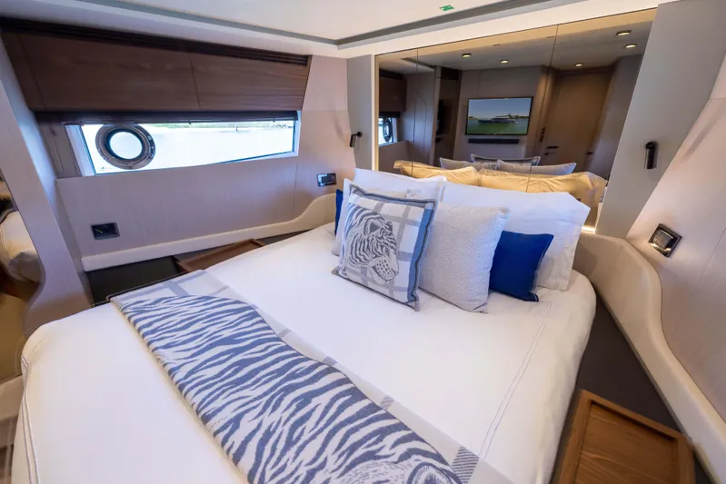 Second Chances Yacht Photos Pics Luxurious bedroom interior of 2024 Azimut S7 yacht with elegant bedding and modern design.