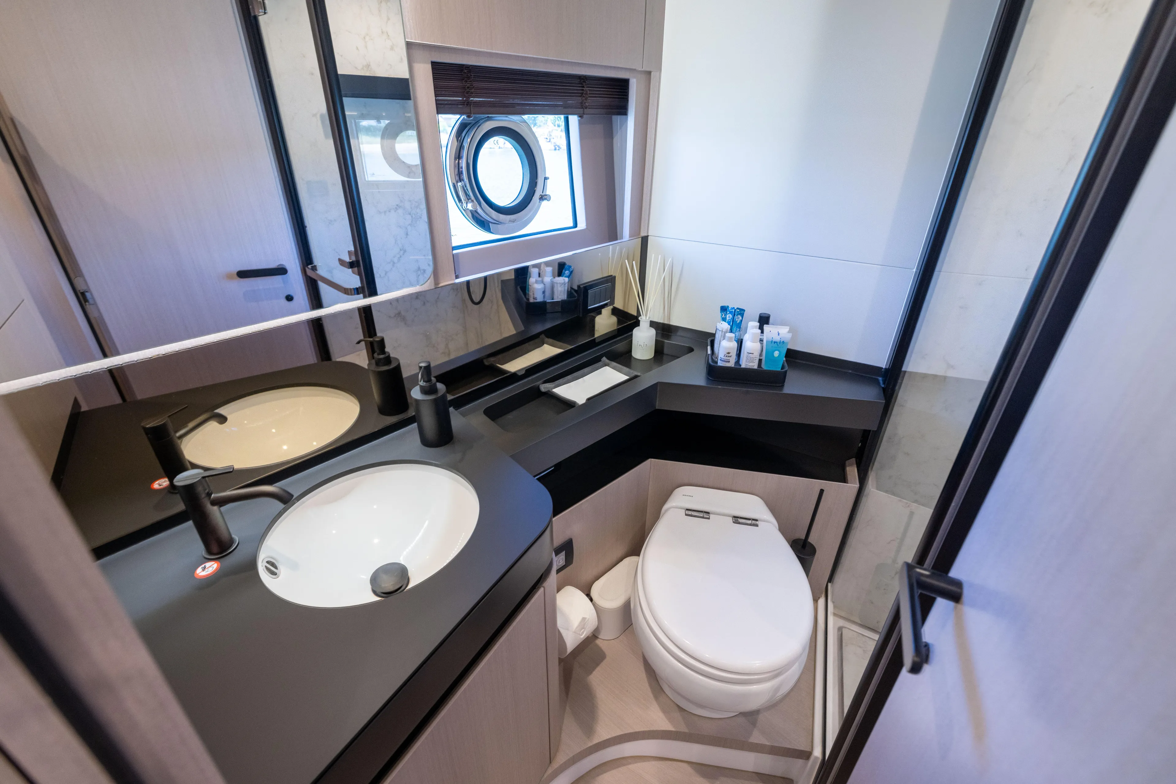 Second Chances Yacht Photos Pics Luxurious bathroom in 2024 Azimut S7 yacht with modern fixtures and elegant design.