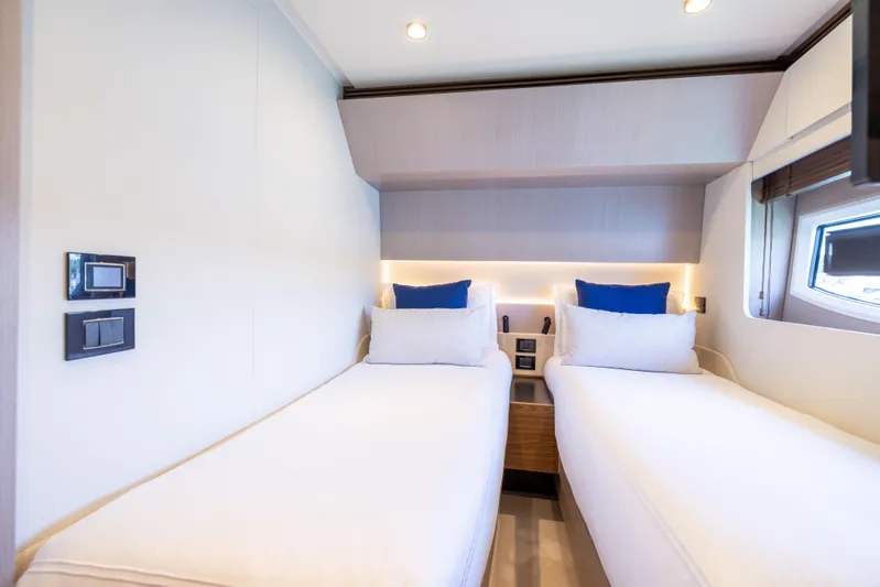 Second Chances Yacht Photos Pics Luxurious twin cabin interior of 2024 Azimut S7 yacht with modern design and ambient lighting.