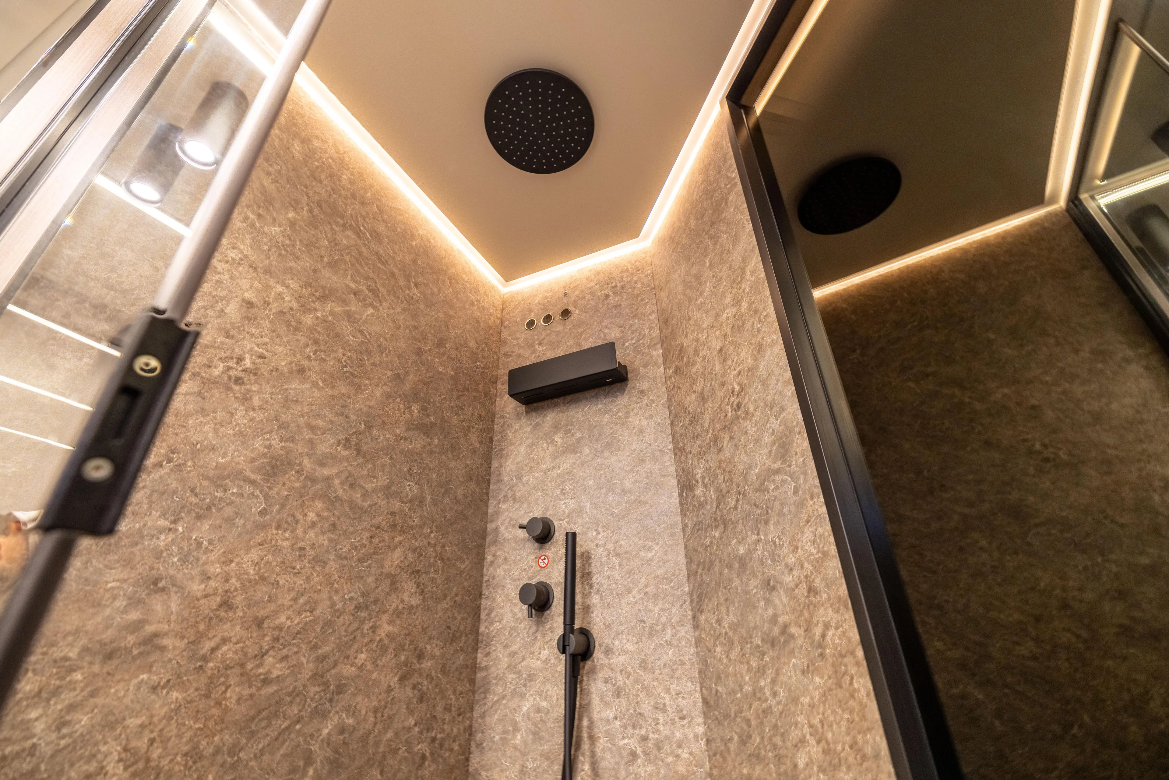 Second Chances Yacht Photos Pics Luxurious shower interior in 2024 Azimut S7 yacht, featuring modern fixtures and ambient lighting.