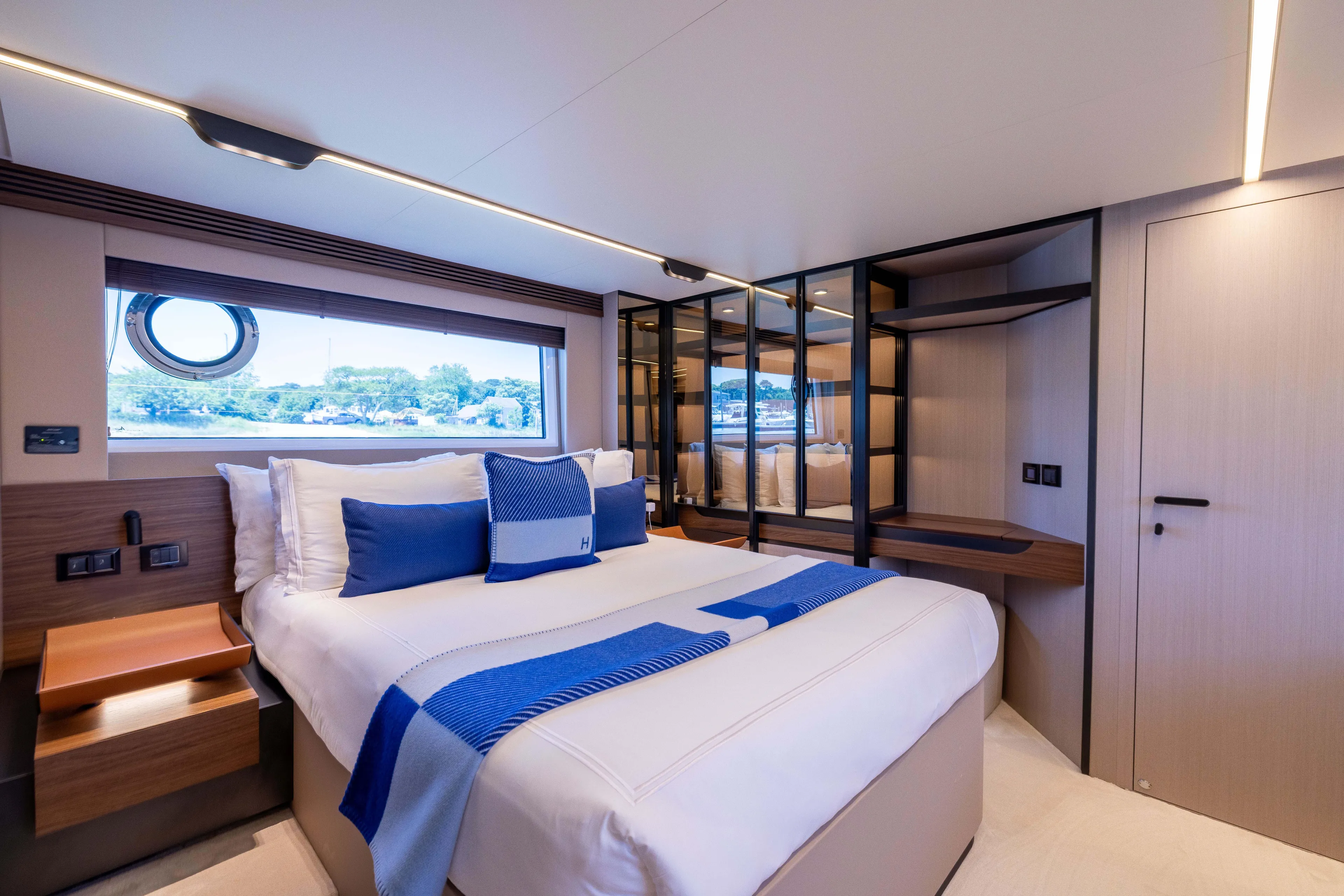 Second Chances Yacht Photos Pics Luxurious bedroom interior of 2024 Azimut S7 yacht with modern design and elegant furnishings.