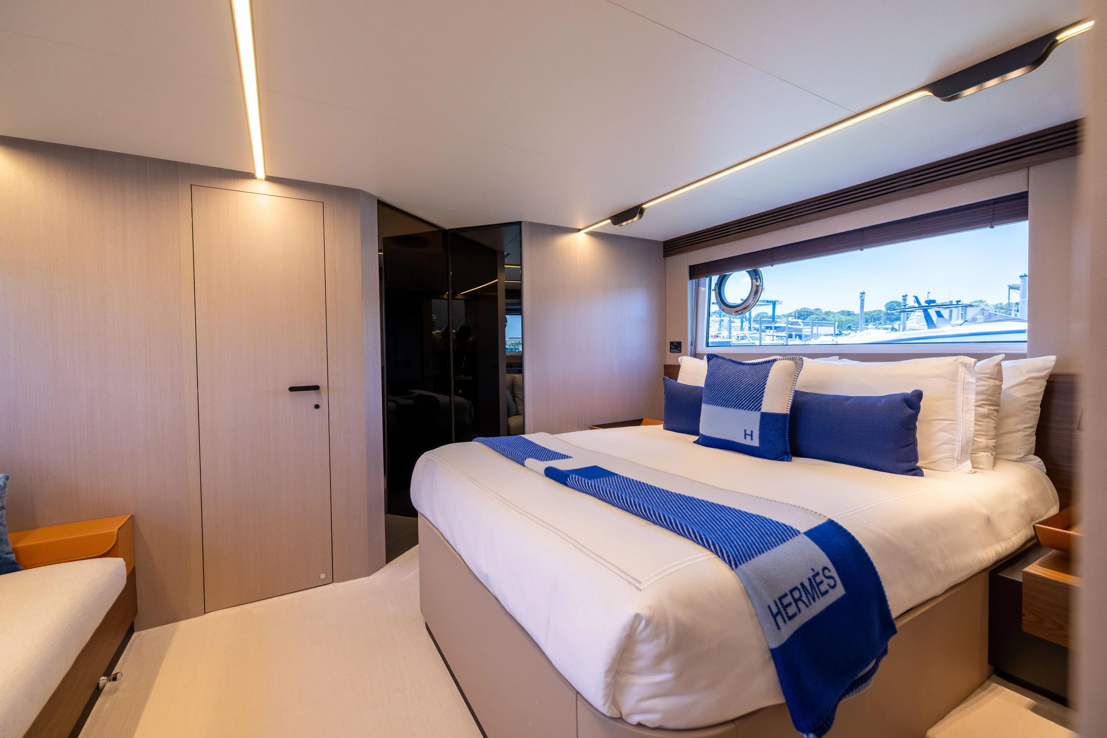 Second Chances Yacht Photos Pics Luxurious bedroom interior of 2024 Azimut S7 yacht with elegant bedding and modern design.