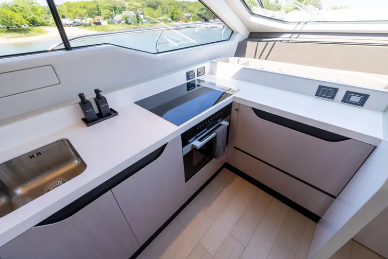 Second Chances Yacht Photos Pics Modern kitchen interior of 2024 Azimut S7 yacht with sleek design and appliances.