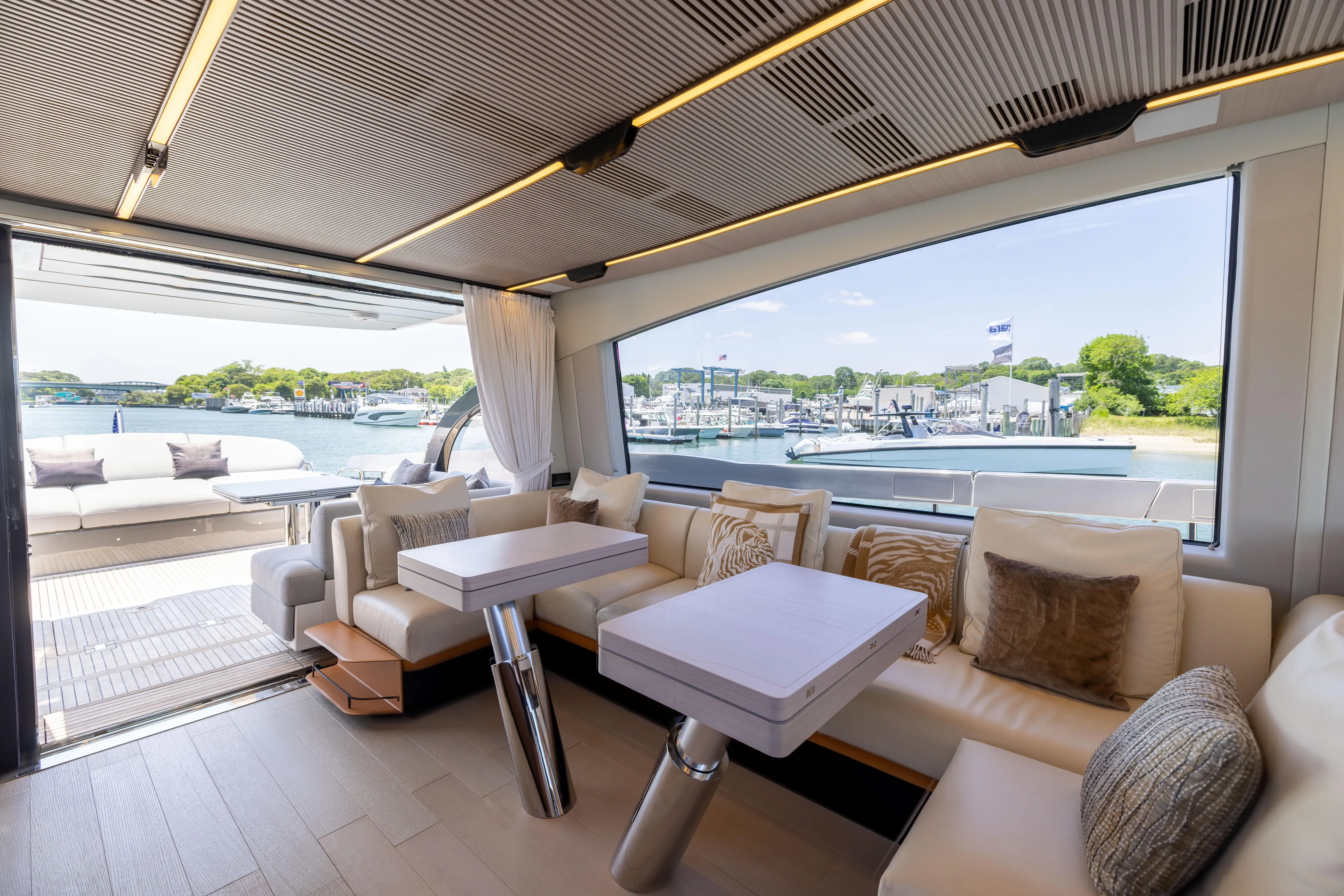 Second Chances Yacht Photos Pics Luxurious interior of 2024 Azimut S7 yacht with scenic marina view.
