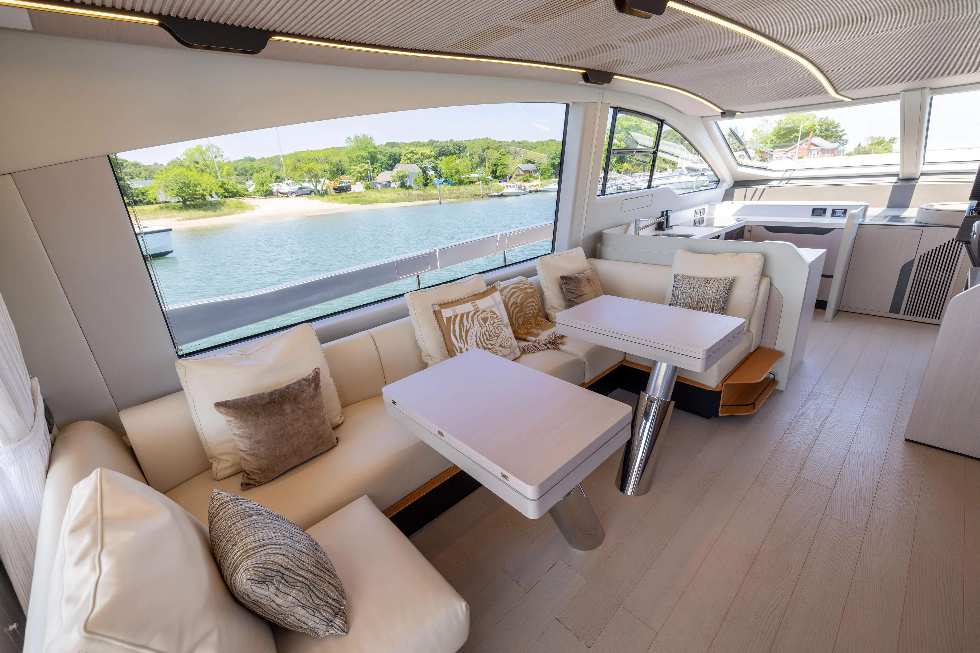 Second Chances Yacht Photos Pics Luxurious interior of 2024 Azimut S7 yacht with elegant seating and scenic window view.