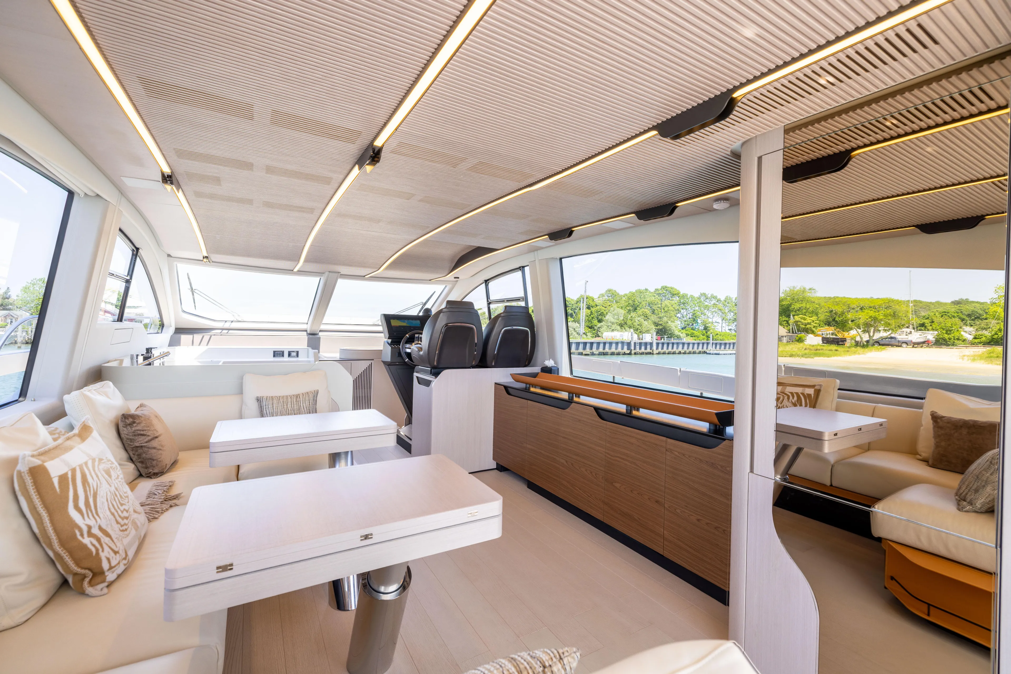 Second Chances Yacht Photos Pics Luxurious interior of 2024 Azimut S7 yacht with modern seating and panoramic windows.