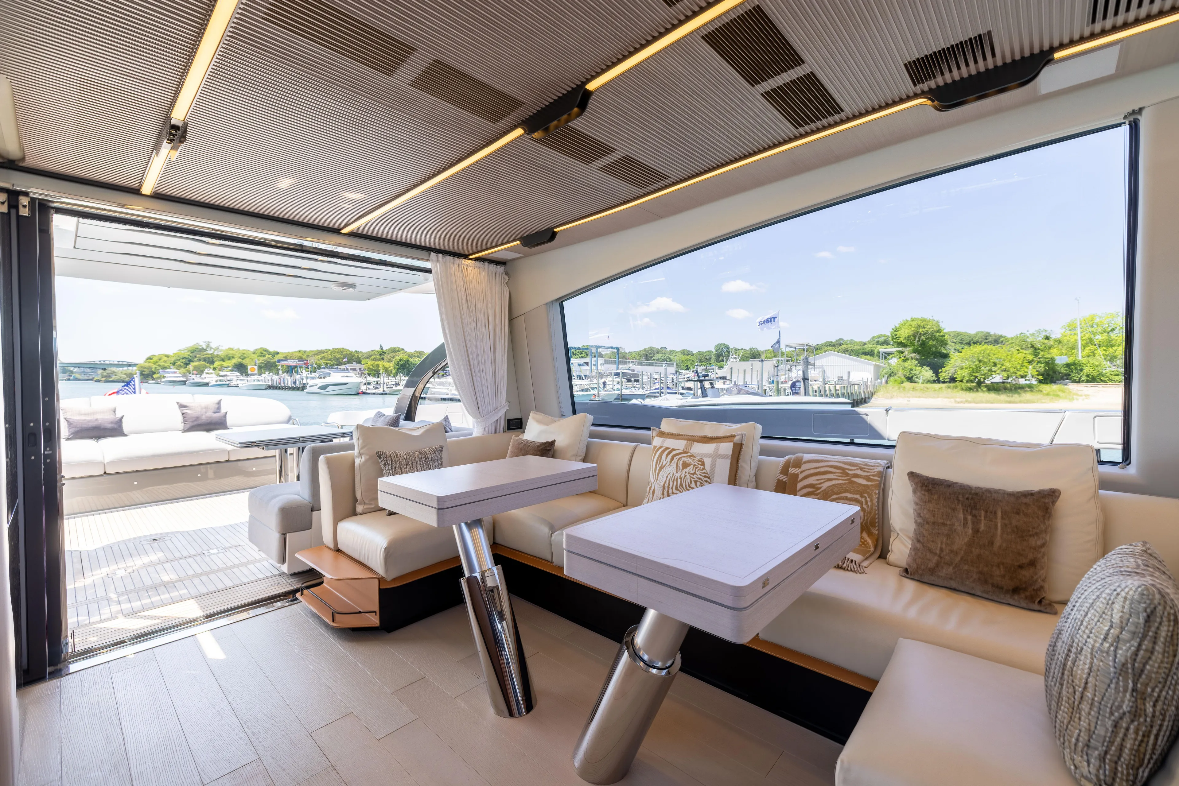 Second Chances Yacht Photos Pics Luxurious interior of 2024 Azimut S7 yacht with elegant seating and scenic views.