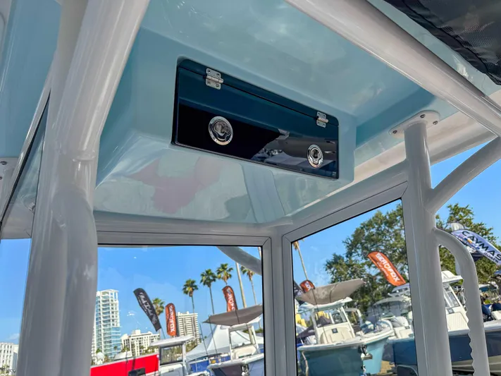 Hybrid Performance Yacht Photos Pics 2025 Caymas 24 HB boat interior with storage compartment, showcasing sleek design and modern features.