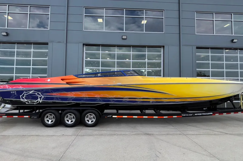  Yacht Photos Pics 2007 Fountain 42 Lightning speedboat with vibrant gradient paint on a trailer.