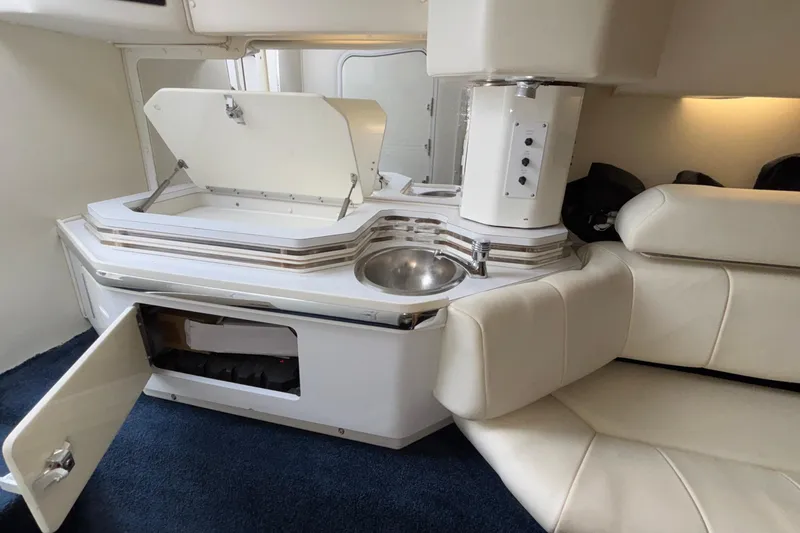  Yacht Photos Pics 2007 Fountain 42 Lightning interior with kitchenette and seating area.