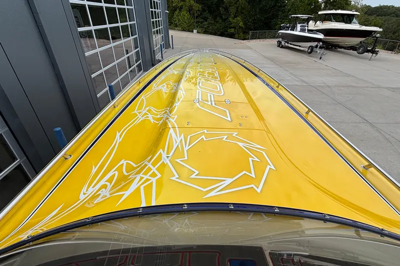  Yacht Photos Pics Yellow 2007 Fountain 42 Lightning boat with sleek design and bold graphics.
