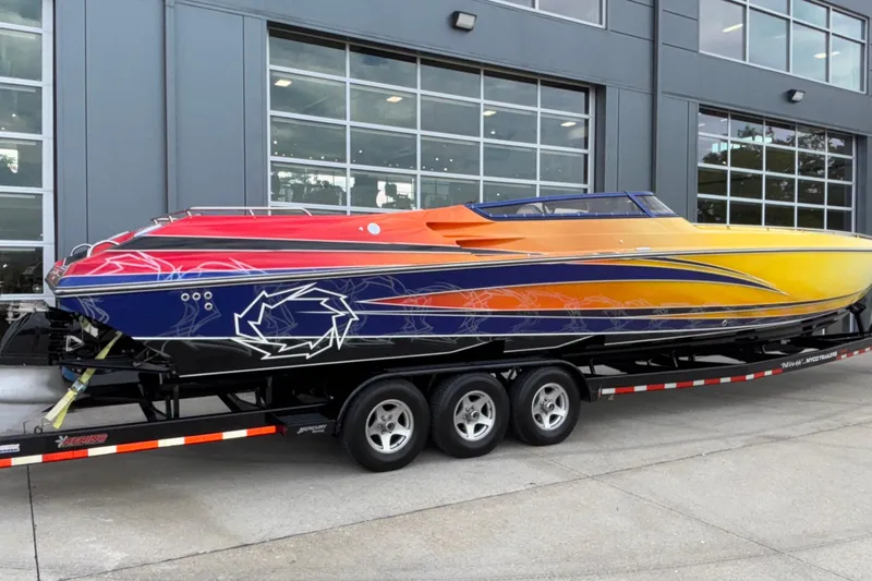  Yacht Photos Pics 2007 Fountain 42 Lightning speedboat with vibrant custom paint on a trailer.