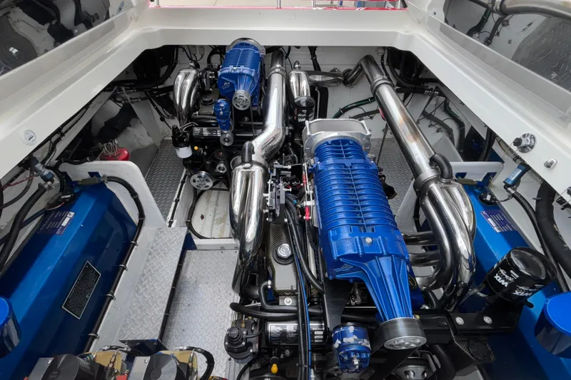  Yacht Photos Pics Engine compartment of a 2007 Fountain 42 Lightning boat, featuring dual blue engines.