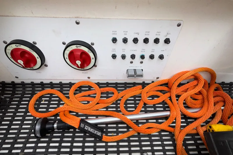  Yacht Photos Pics Control panel with switches and orange rope on a 2007 Fountain 42 Lightning boat.