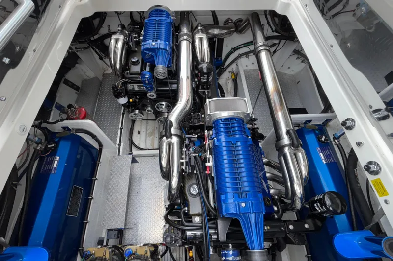  Yacht Photos Pics Engine compartment of 2007 Fountain 42 Lightning boat, featuring blue and chrome components.