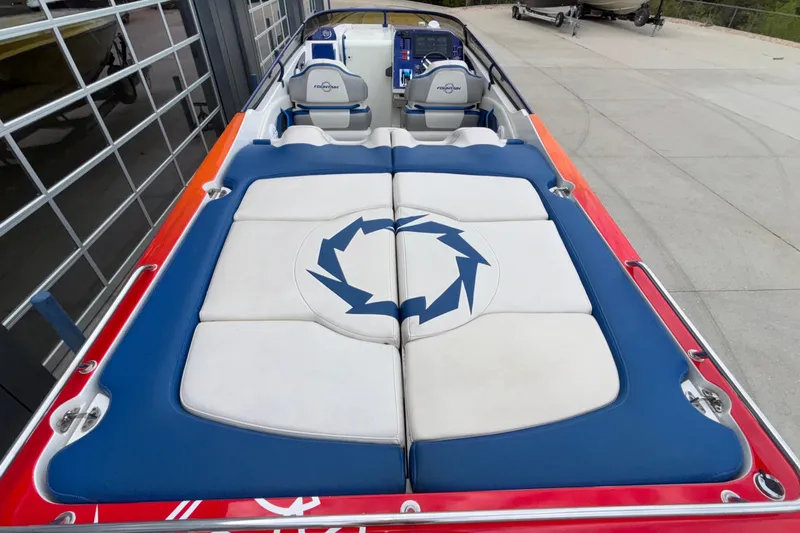  Yacht Photos Pics 2007 Fountain 42 Lightning boat interior with blue and white seating.