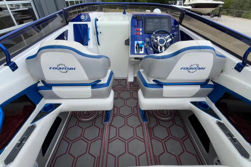  Yacht Photos Pics Interior of a 2007 Fountain 42 Lightning boat with modern dashboard and seating.