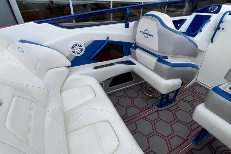  Yacht Photos Pics Interior of 2007 Fountain 42 Lightning boat with white and blue seating.
