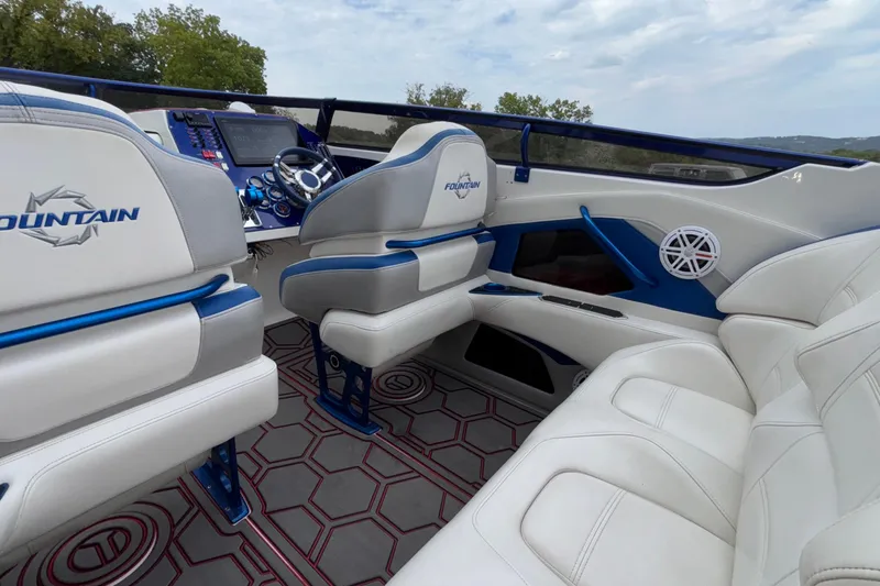  Yacht Photos Pics Interior of a 2007 Fountain 42 Lightning boat with white and blue seating.