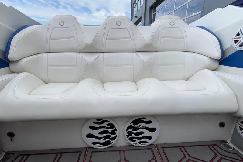  Yacht Photos Pics White leather seating on a 2007 Fountain 42 Lightning boat with stylish speaker design.