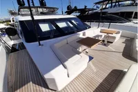 Luxurious 2019 Custom Line 106 yacht deck with seating and tables, featuring sleek design.