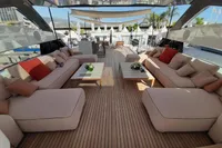 Luxurious 2019 Custom Line 106 yacht deck with elegant seating and modern decor.