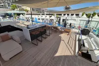 Luxurious 2019 Custom Line 106 yacht deck with modern seating and bar area.