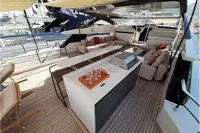 Luxurious 2019 Custom Line 106 yacht deck with seating, bar, and canopy.