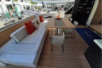 Luxurious 2019 Custom Line 106 yacht deck with seating and dining area.