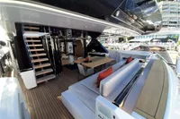 Luxurious 2019 Custom Line 106 yacht deck with modern seating and dining area.