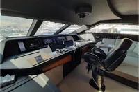Luxurious 2019 Custom Line 106 yacht cockpit with modern navigation equipment and plush seating.