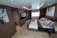 Luxurious bedroom interior on a 2019 Custom Line 106 yacht, featuring modern decor and elegant furnishings.