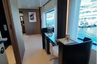 Luxurious interior of 2019 Custom Line 106 yacht with modern decor and large windows.