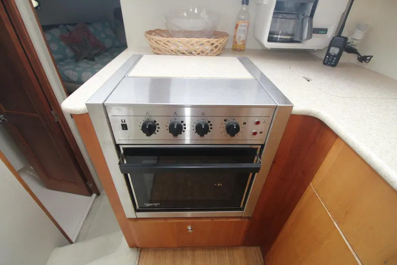 Jet Lag Yacht Photos Pics Stainless steel oven in 2000 Silverton 392 Motor Yacht kitchen area.