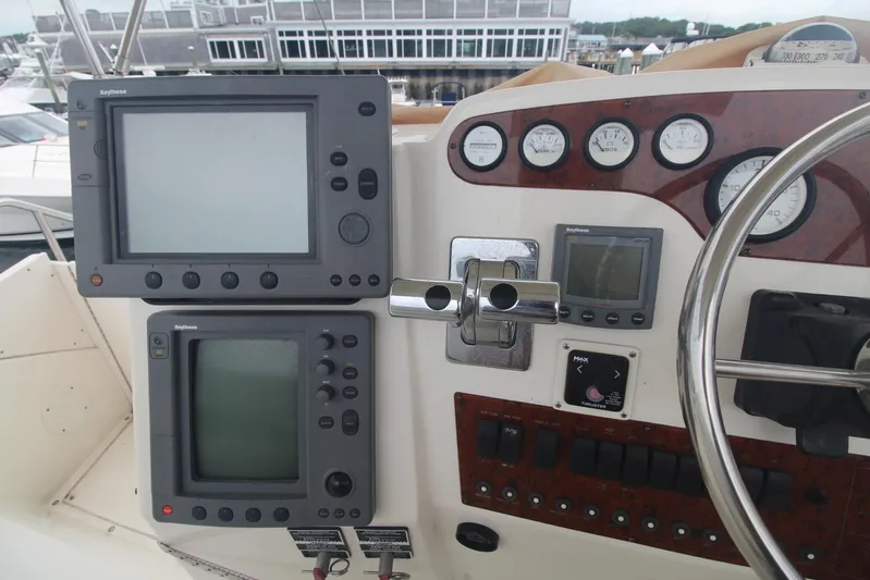 Jet Lag Yacht Photos Pics Control panel of a 2000 Silverton 392 Motor Yacht with navigation instruments and gauges.