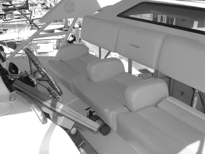 Jet Lag Yacht Photos Pics 2000 Silverton 392 Motor Yacht interior with steering wheel and cushioned seating.