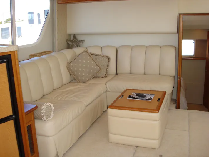 Jet Lag Yacht Photos Pics Luxurious interior of 2000 Silverton 392 Motor Yacht with plush seating and elegant decor.