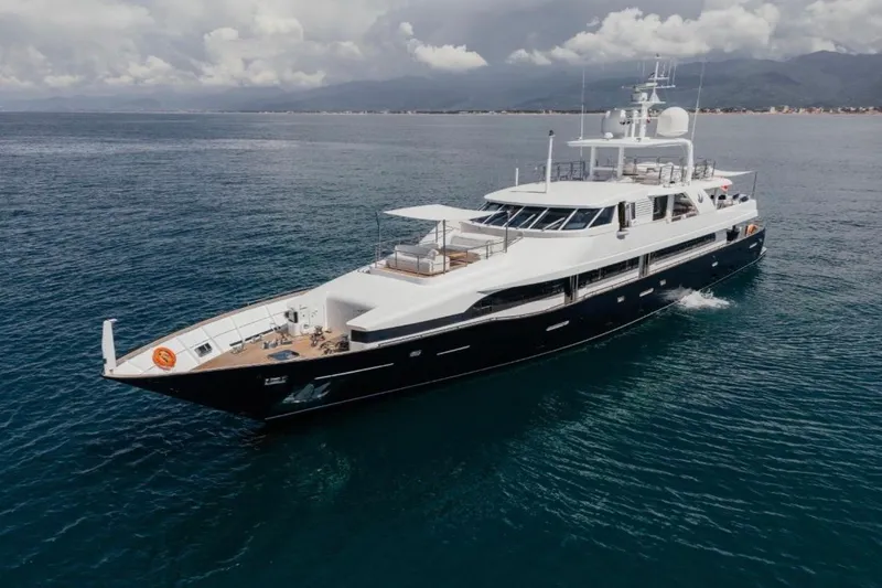 Lady In Blue Yacht Photos Pics Luxurious Clemna Rossi Navi 135 yacht cruising on open sea, 1999 model.