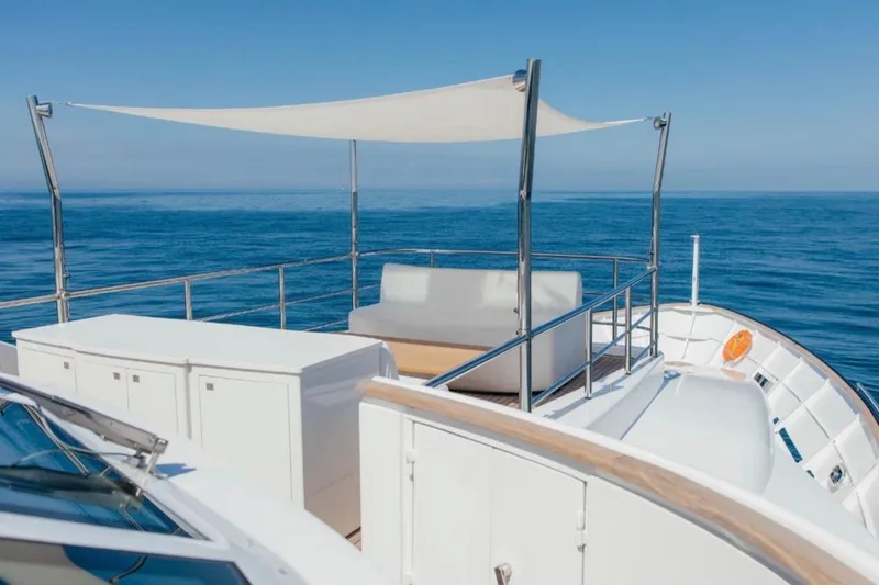 Lady In Blue Yacht Photos Pics Luxury yacht deck of Clemna Rossi Navi 135, 1999, with ocean view and seating area.