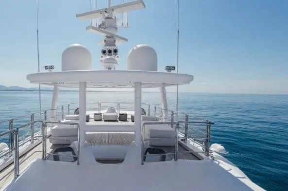 Lady In Blue Yacht Photos Pics Luxurious Clemna Rossi Navi 135 yacht deck, 1999 model, cruising on serene blue waters.