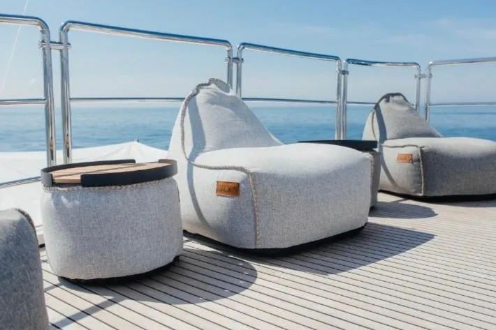 Lady In Blue Yacht Photos Pics Luxury deck seating on Clemna Rossi Navi 135 yacht, 1999 model, with ocean view.