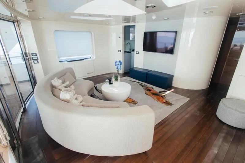 Lady In Blue Yacht Photos Pics Luxurious interior of 1999 Clemna Rossi Navi 135 yacht with modern furnishings and elegant decor.