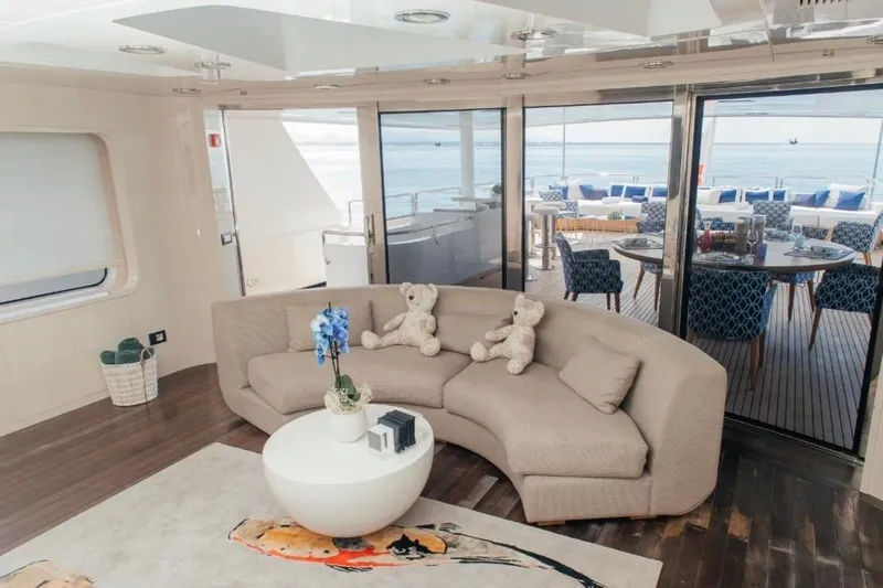 Lady In Blue Yacht Photos Pics Luxurious Clemna Rossi Navi 135 yacht interior with elegant seating and ocean view, 1999 model.