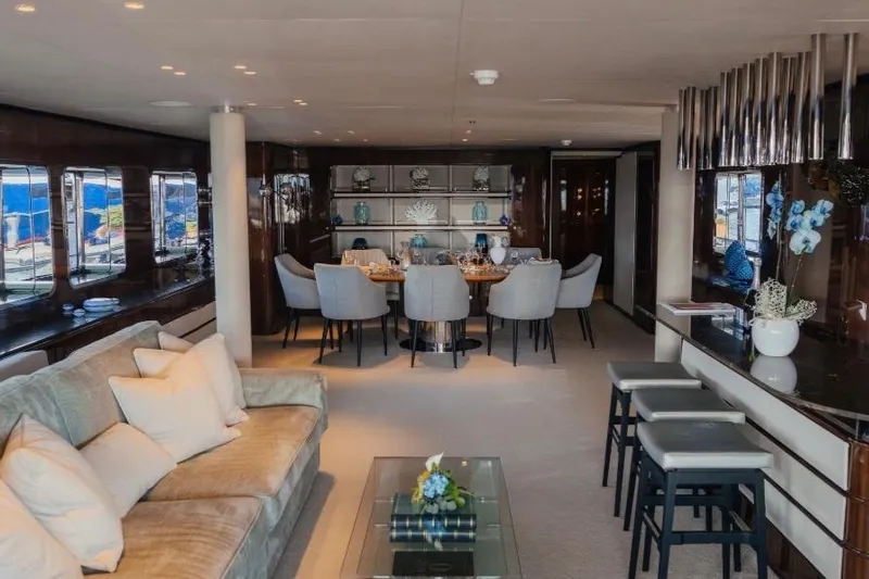 Lady In Blue Yacht Photos Pics Luxurious interior of 1999 Clemna Rossi Navi 135 yacht with elegant dining area.