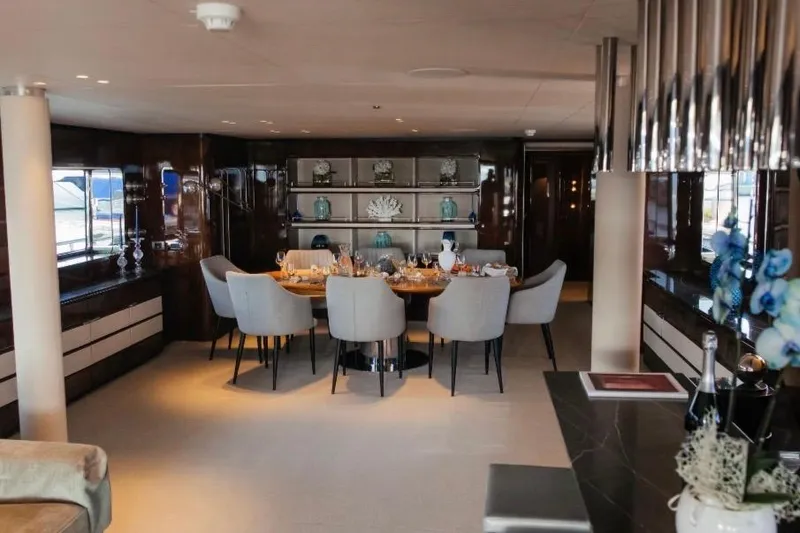 Lady In Blue Yacht Photos Pics Luxurious dining area on Clemna Rossi Navi 135 yacht, featuring elegant decor and modern furnishings.