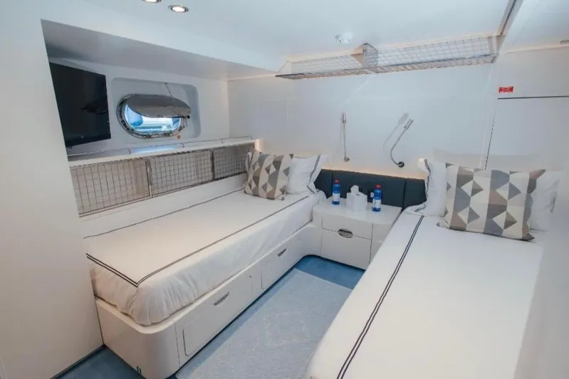 Lady In Blue Yacht Photos Pics Interior of Clemna Rossi Navi 135 yacht, featuring twin beds and modern decor, 1999 model.