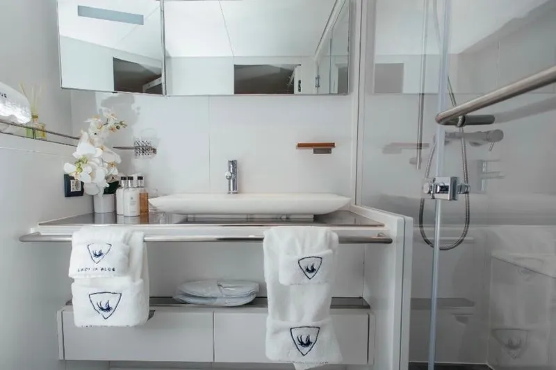 Lady In Blue Yacht Photos Pics Luxurious bathroom on Clemna Rossi Navi 135 yacht, featuring modern sink and elegant decor.