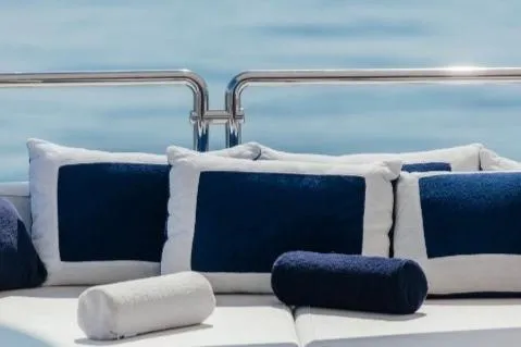 Lady In Blue Yacht Photos Pics Luxurious Clemna Rossi Navi 135 yacht cushions, 1999 model, with blue and white design.
