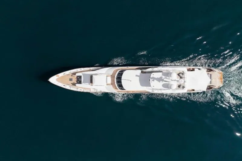 Lady In Blue Yacht Photos Pics Aerial view of Clemna Rossi Navi 135 yacht cruising on open water, 1999 model.